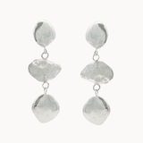 dangle earrings each with three pebble-like disks on a white background