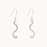 A pair of silver dangle earrings with a textured, wavy S-shaped drop and fishhook wires, shown against a plain off-white background.