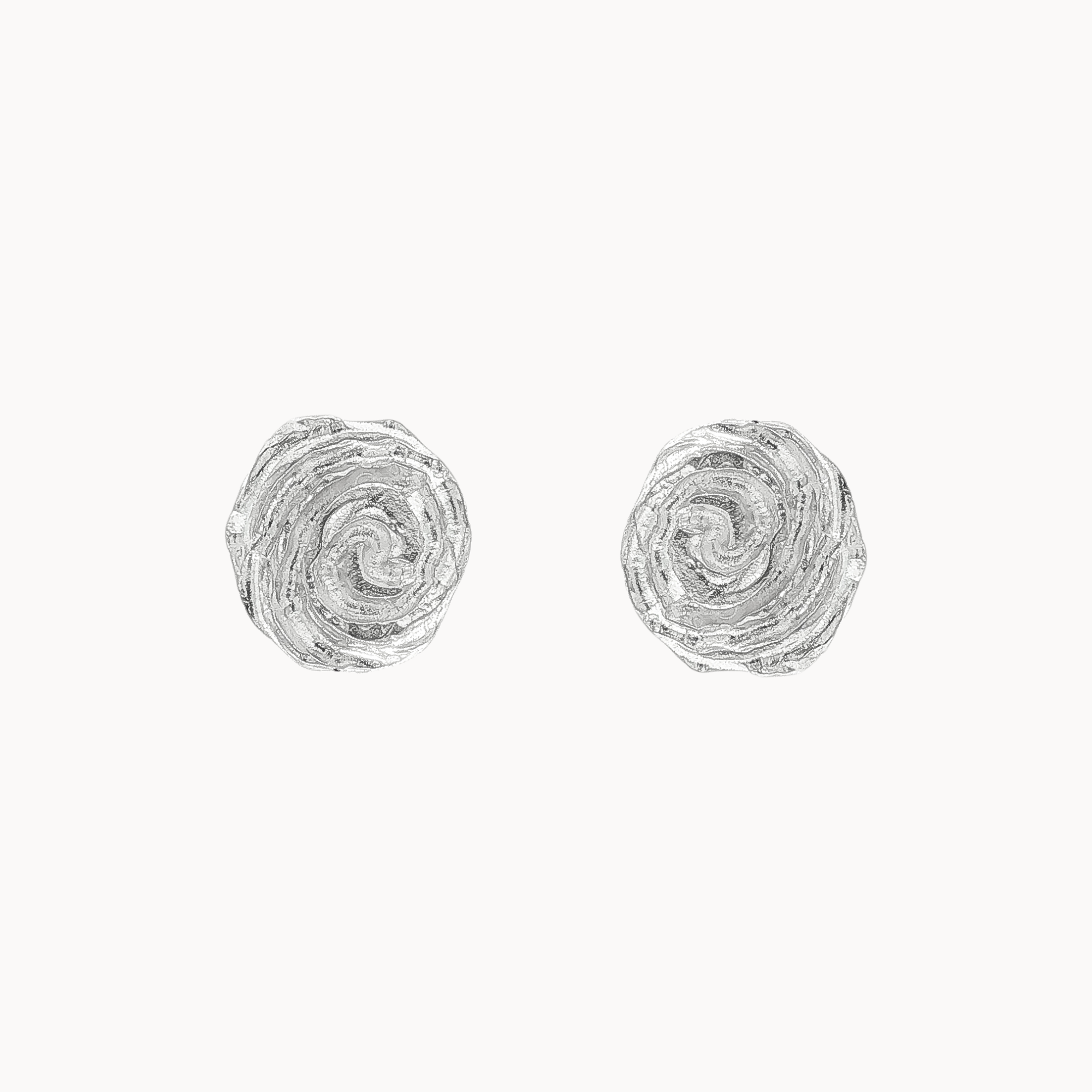 A pair of textured silver stud earrings with a spiral rose design, shown on a plain off-white background.