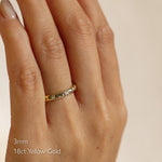 Gold star and diamond wedding ring on a hand with '3mm 18ct Yellow Gold' text