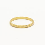 cut out of yellow gold wedding ring with star engraving and small round diamonds and shadow