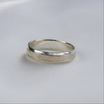 white gold bespoke wedding ring with textured central design