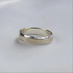 white gold bespoke wedding ring with textured central design