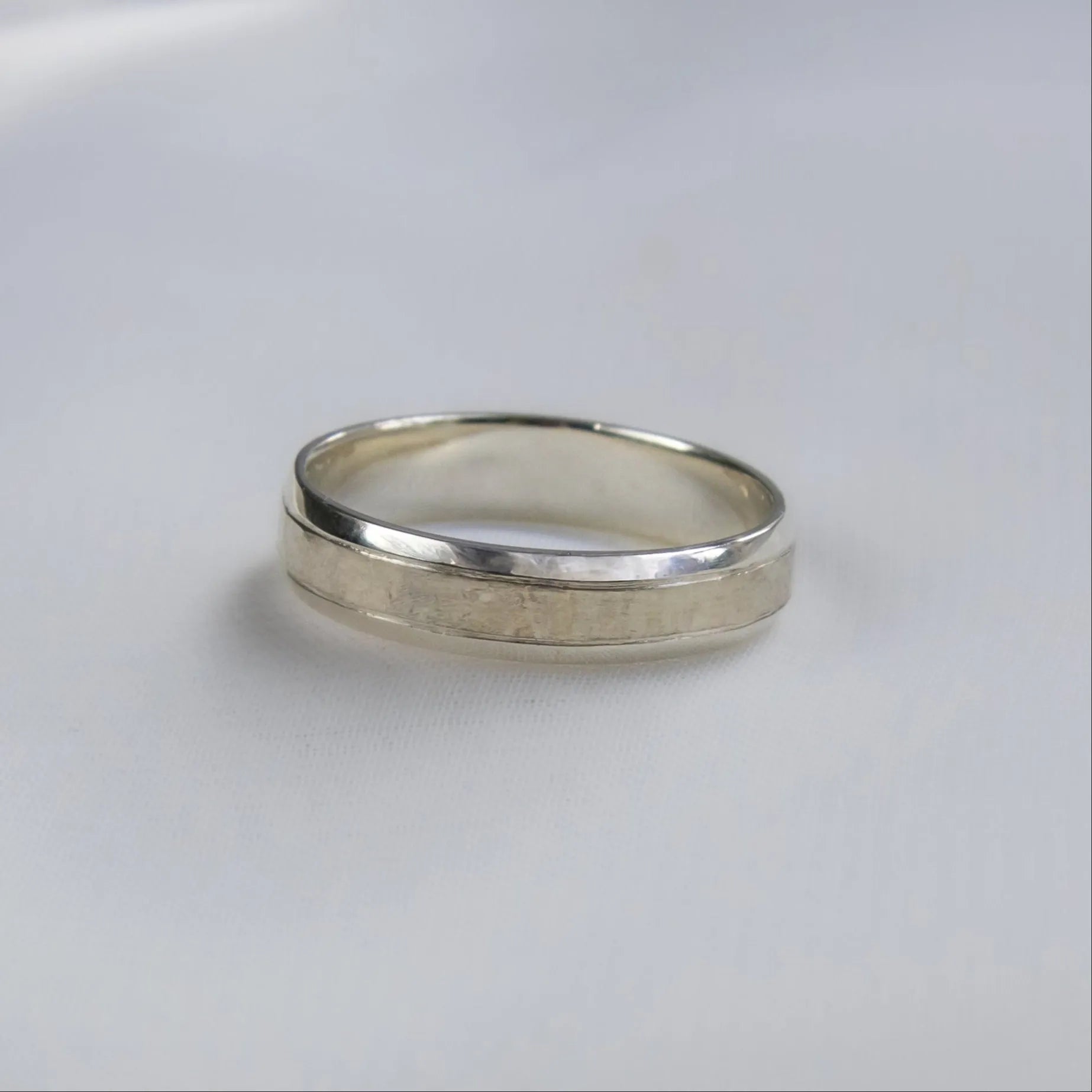 white gold bespoke wedding ring with textured central design