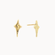 Gold four-point star stud earrings on a white background