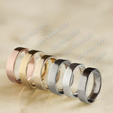 Set of wedding rings in various colors on a beige background