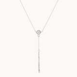 white gold y-shaped lariat necklace with a small round diamond pendant and molten bar detail on a white background