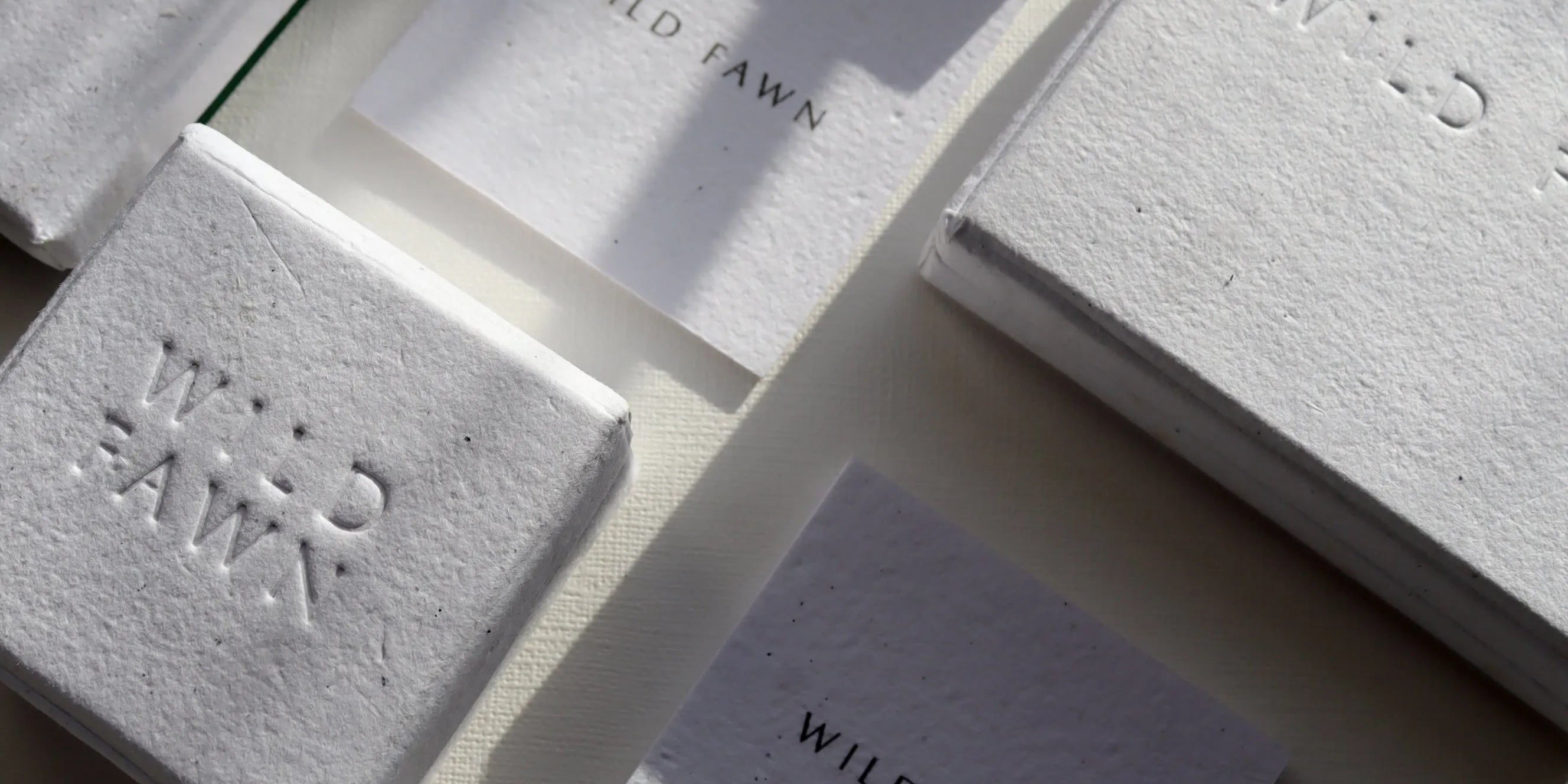 white packaging boxes with wild fawn engraving